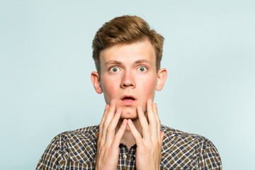 omg unbelievable shock amazement. dumbfounded man with open mouth. portrait of a young guy on light background. emotion facial expression and reaction concept. - obrazy, fototapety, plakaty