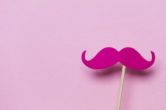 Pink Moustache On A Pink Background. Modern Masculinity Concept