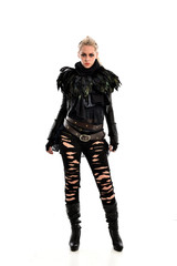 Fototapeta premium full length portrait of blonde girl wearing torn black feather costume. standing pose, isolated on white background.