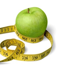 A Green Apple and a Measuring Tape