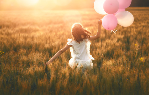 Girl running on cereal field