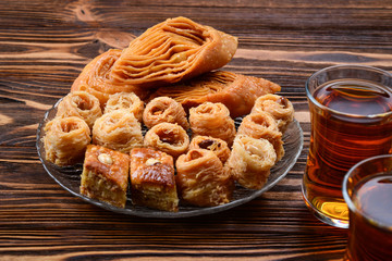 Turkish sweet baklava on plate with Turkish tea.