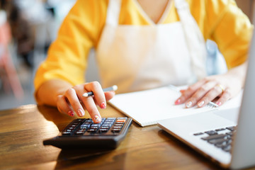 close up on finger hand press on calculator for computing,working woman concept.	
