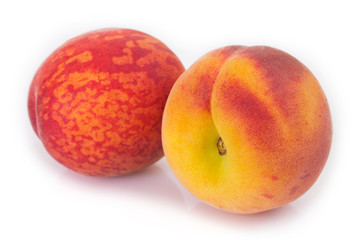 Fresh peaches on white background