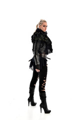 full length portrait of blonde girl wearing torn black feather costume. standing pose, isolated on white background.