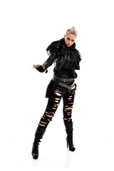 full length portrait of blonde girl wearing torn black feather costume. standing pose, isolated on white background.