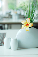 Frangipani flower on dining table setting