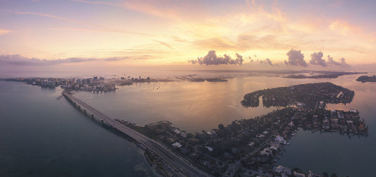 Aerial Cityscape  at dawn across Sarasota Bay with John Ringling Causeway and Bird Key, Sarasota, Florida, USA