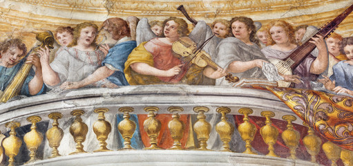PARMA, ITALY - APRIL 16, 2018: The fresco of Choir of angels with the music instruments in church Chiesa di Santa Croce by Giovanni Maria Conti della Camera (1614 - 1670).