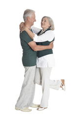 portrait of  senior couple dancing   isolated