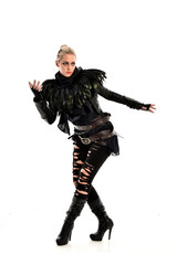 Obraz premium full length portrait of blonde girl wearing torn black feather costume. standing pose, isolated on white background.