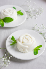 Panna Cotta, traditional sweet Italian dessert, with mint and pear