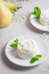 Panna Cotta, traditional sweet Italian dessert, with mint and pear