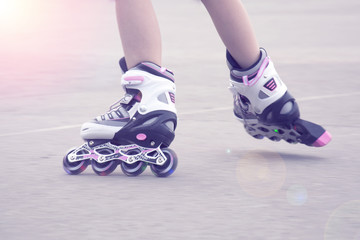 Girl on roller skates riding outdoors