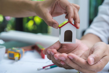 Engineer and architect team of real estate agency and company presidents discussing or analyzing to build a housing estate project. Concept of constuction contract and deal.