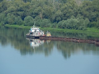 View of the river Don. Photo of a beautiful nature in the summer. Dredging vessel on the Don river - 212937519