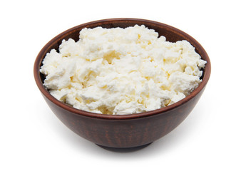 Freshly grained homemade cottage cheese, isolated on white background.