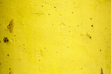 Yellow painted concrete background texture