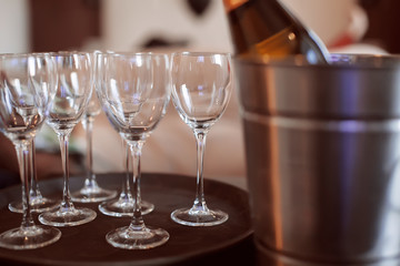 Cold chilled champagne in ice bucket with glasses