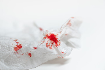 Fototapeta na wymiar Red blood on tissue toilet paper.