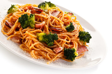 Pasta with pesto sauce, ham, Parmesan and broccoli