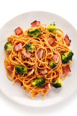 Pasta with pesto sauce, ham, Parmesan and broccoli