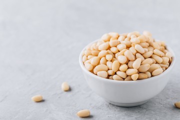 Raw pine nuts in bowl