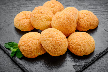Amaretti cookies in a glass bowl on old wooden background