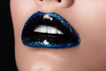 Naklejka premium Sexual full female lips open. Blue color of lipstick on lips. Creative New Year's make-up. Fashionable image. Brilliants