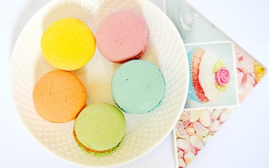 Macarons on plate, pastel, flat lay 