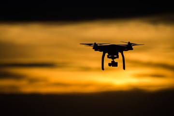 Drone flying at sunset