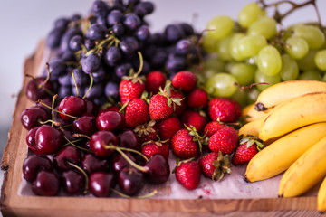Fruits on a wooden plate