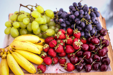 Fruits on a wooden plate