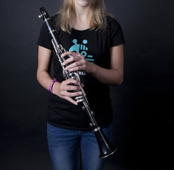 Girl plays on the clarinet