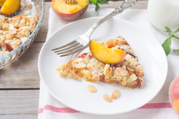 Peach crumble on a wooden and textile background