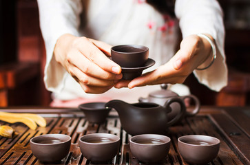 Fototapeta Woman serving Chinese tea in a tea ceremony obraz