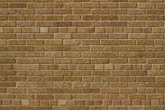 Vintage golden brown color brick wall background in Scottish bond pattern