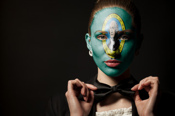 Portrait of woman with painted Washington usa state flag and bow tie