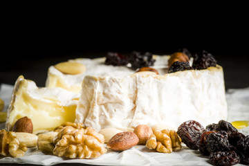 Camembert cheese with nuts, fruit and honey