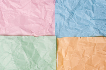 Obraz premium Blue pink orange green crumpled background paper texture