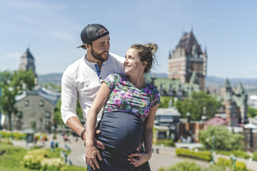 Pregnant couple portrait outside in Quebec city