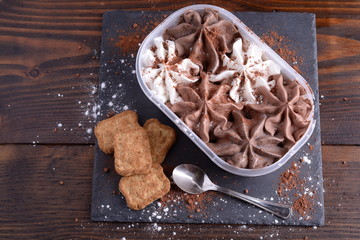Milk chocolate ice cream, white and dark in a bowl 