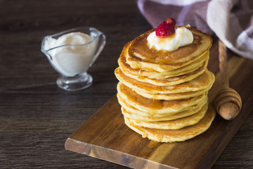 Homemade fluffy pancakes served with honey