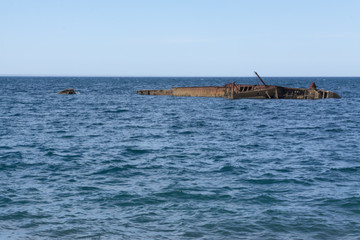Fototapeta na wymiar Ship wreck by the city