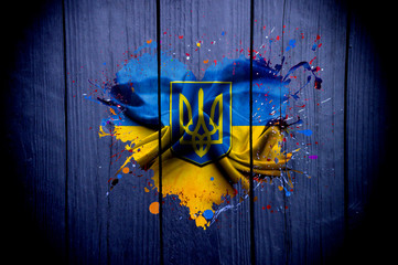 Flag of Ukraine in the shape of heart on a dark background