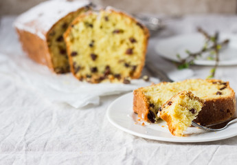 Slices of homemade raisin and orange loaf cake. Raisin bread cake. Breakfast concept. Rustic style.
