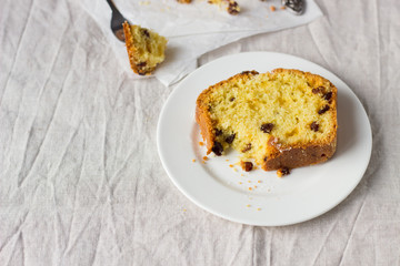 Slices of homemade raisin and orange loaf cake. Raisin bread cake. Breakfast concept. Rustic style.