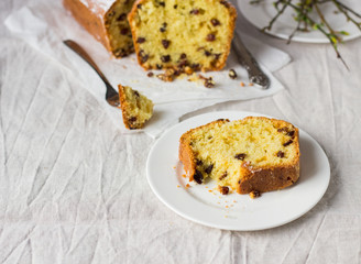 Slices of homemade raisin and orange loaf cake. Raisin bread cake. Breakfast concept. Rustic style.