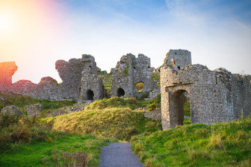 Fototapeta na wymiar Countryside landscape with ruined castle, hills and sky. Stradbally, County Laois, Ireland