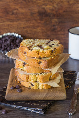 Pound chocolate drops cake piece stack on a wooden board 